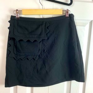 Victoria Beckham black skirt with a scalloped accent pocket. Size small